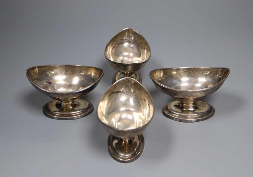A set of four George III silver navette shaped pedestal salts, Thomas Wallis II, London, 1801, height 58mm, gross 9 oz,